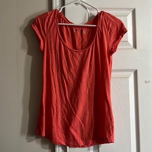 Red camel shirt size small. More coral color not as red as seen in photo.